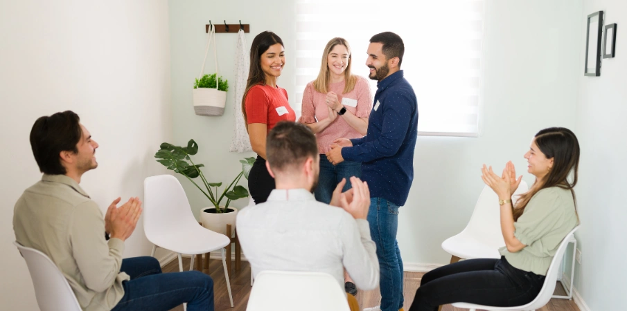 Image of a couple holding hands while exploring recovery support options together